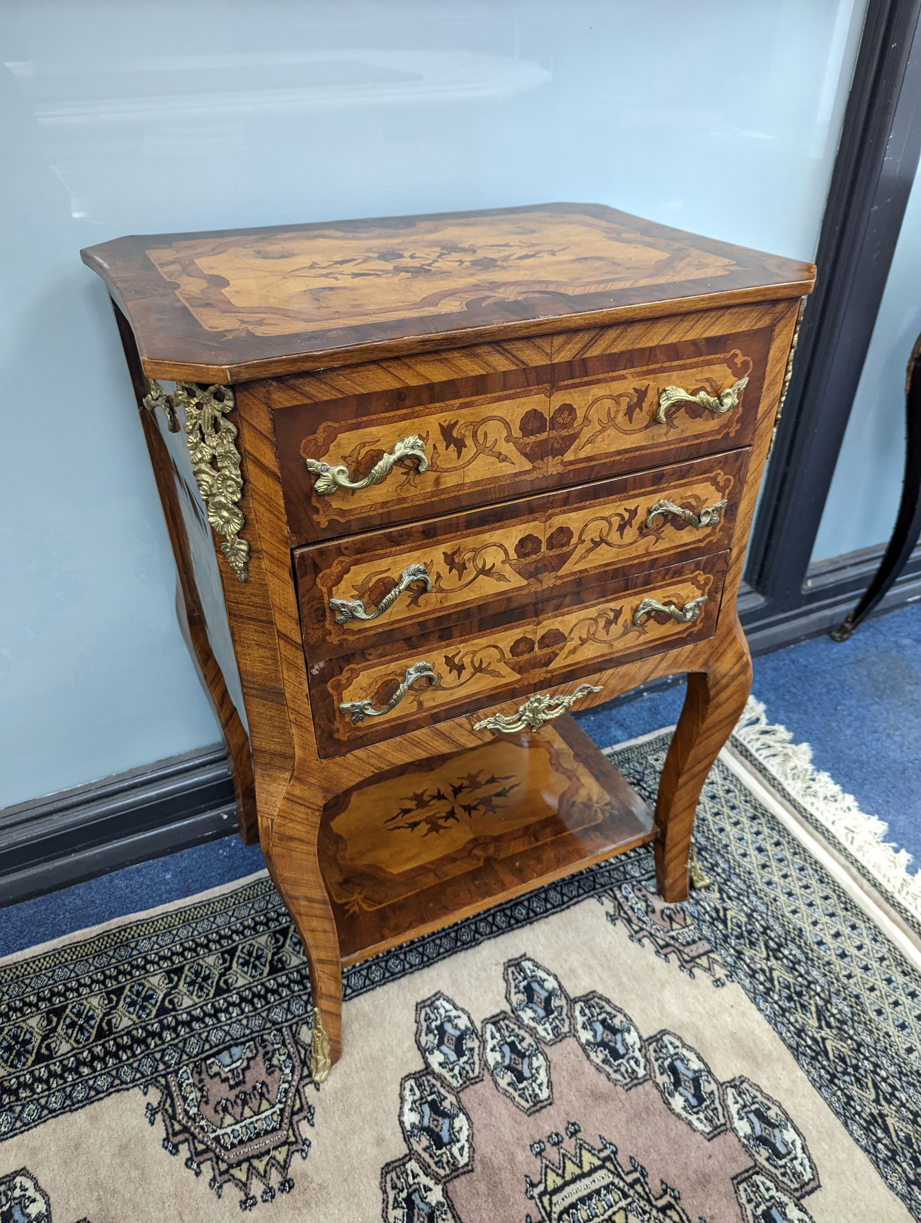 A pair of Louis XVI style marquetry bedside chests, each fitted with a two side drawers above two front long drawers, width 53cm, height 75cm